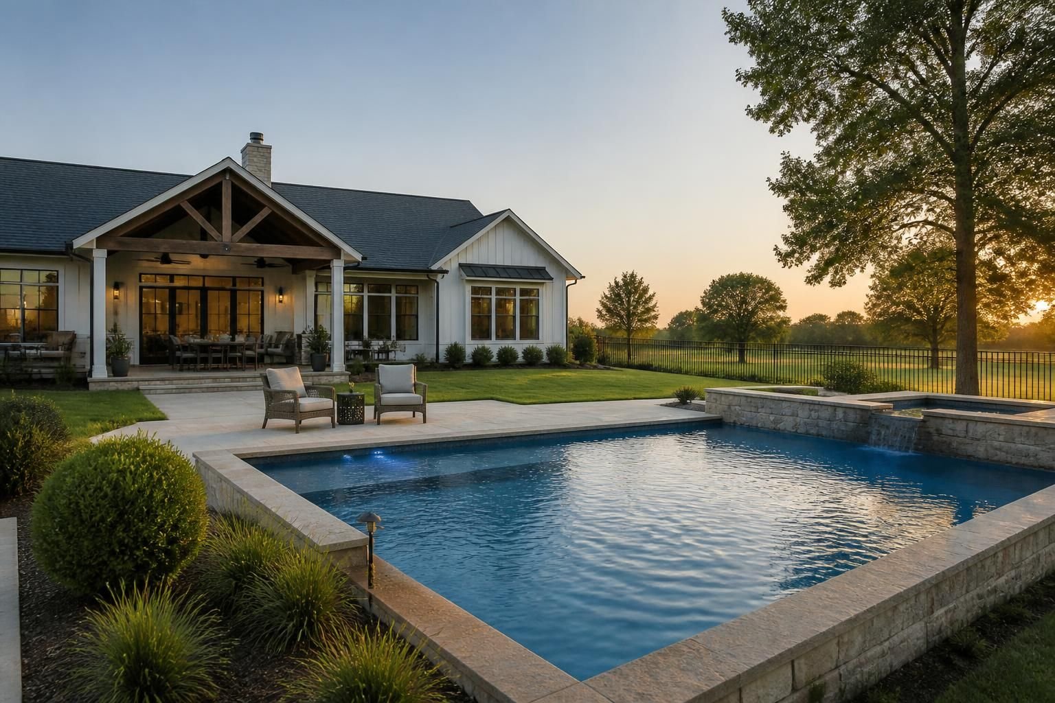 Orchard home with soft greenery and a clean finished backyard pool.
