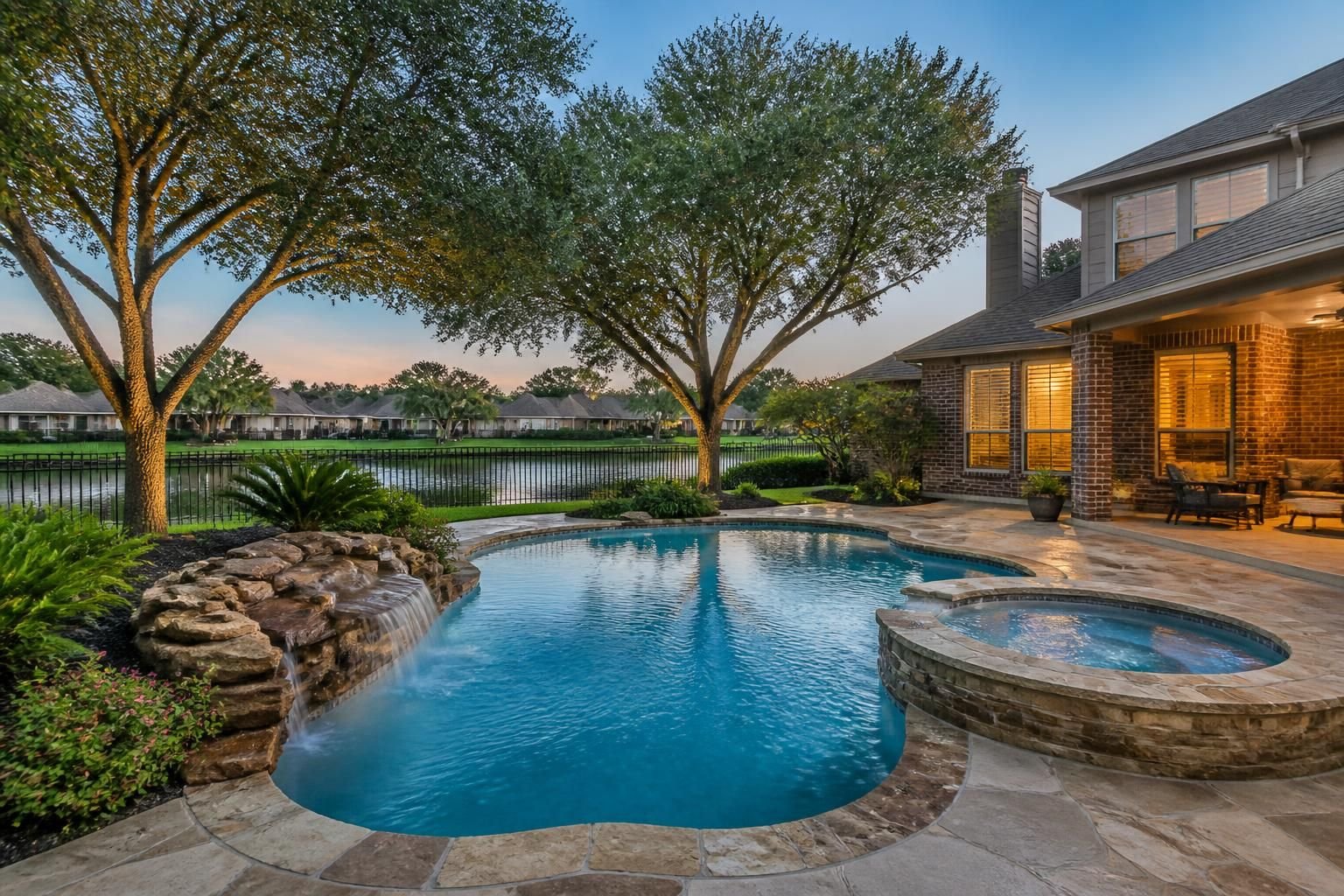 Pecan Grove neighborhood with mature trees and a polished backyard pool.